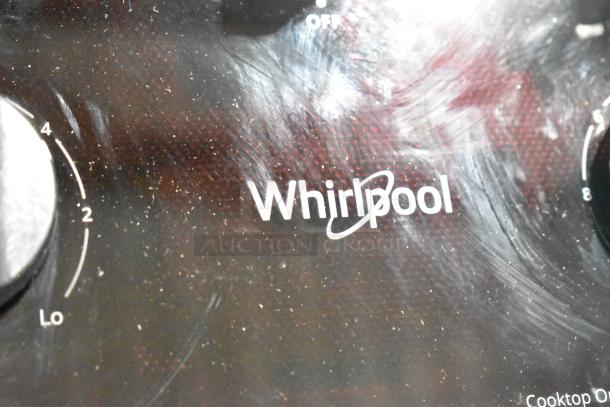 Whirlpool WCE5US6HB00 electric 5 burner range, scratch and dent. "Whirlpool" branding visible. 208/240 Volts.