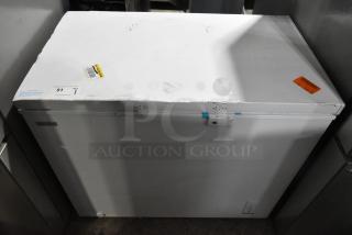 Brand new Vissani MDCF9WH chest freezer, 115 Volts, 1 Phase, with visible scratches and dents. Auction tags attached.