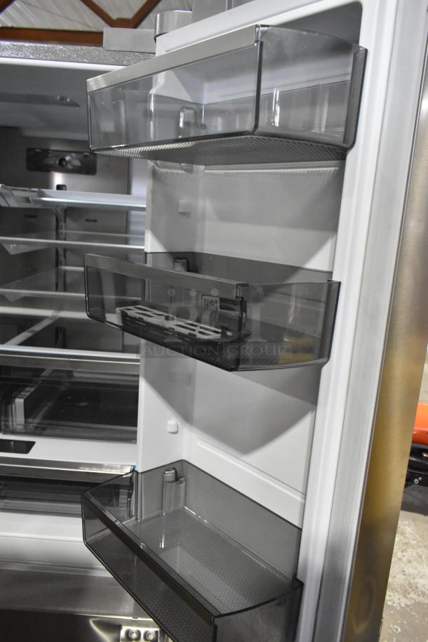 Frigidaire PRFS2883AFF fridge interior. French door style with adjustable shelves, visible ice/water dispenser. New, slight scratches.