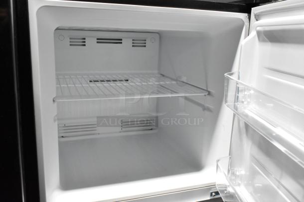 Brand new Vissani MDTF108KES4 cooler and freezer interior, white with wire shelving, 115V, 1 phase, slight dent visible.