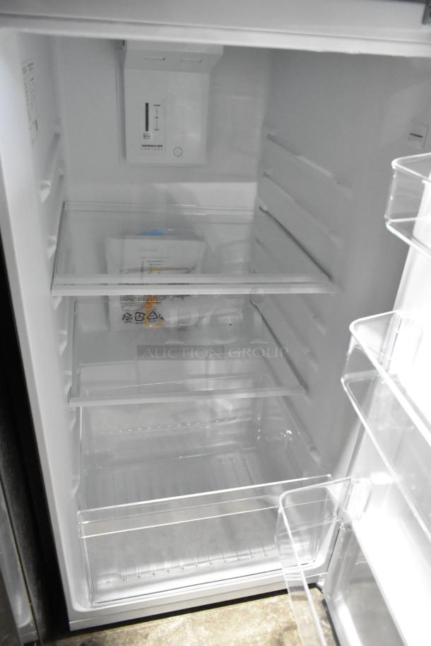 Brand new 2025 Vissani MDTF108KES4 cooler with freezer, visible shelving, 115 volts, 1 phase, scratch and dent condition.