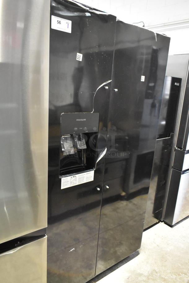 Brand new Frigidaire FRSS2623ABC fridge in black, French door style, visible scratches and dents, ice/water dispenser.