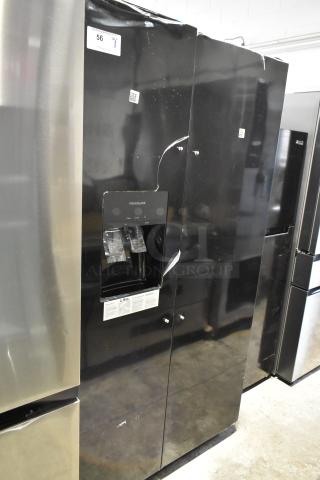 Brand new Frigidaire FRSS2623ABC fridge in black, French door style, visible scratches and dents, ice/water dispenser.