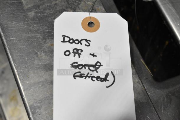 BRAND NEW 2025 Frigidaire FRSS2623ABC cooler with freezer drawer, French door style. Scratch and dent condition. "Doors off" tag shown.