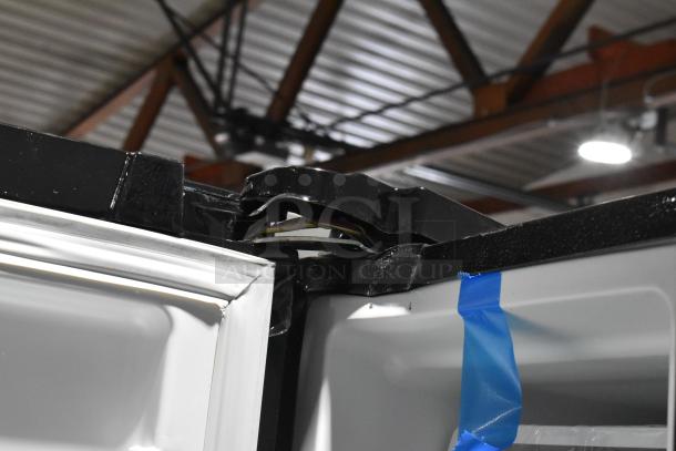 BRAND NEW Frigidaire FRSS2623ABC French Door Cooler showing electrical components and a scratch on the top edge.