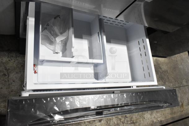 Brand new Samsung RF32CG5400SR French door cooler with freezer drawer, showing spacious interior and protective packaging.