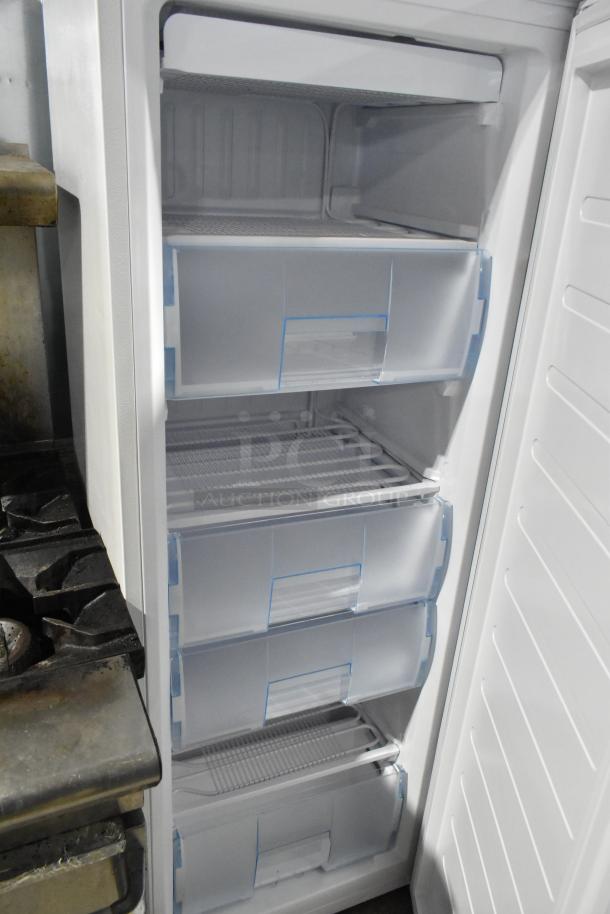 Hamilton Beach HBFRF0011 upright freezer, 11 Cu Ft, new scratch and dent, with clear storage drawers, 115V, 1 phase.