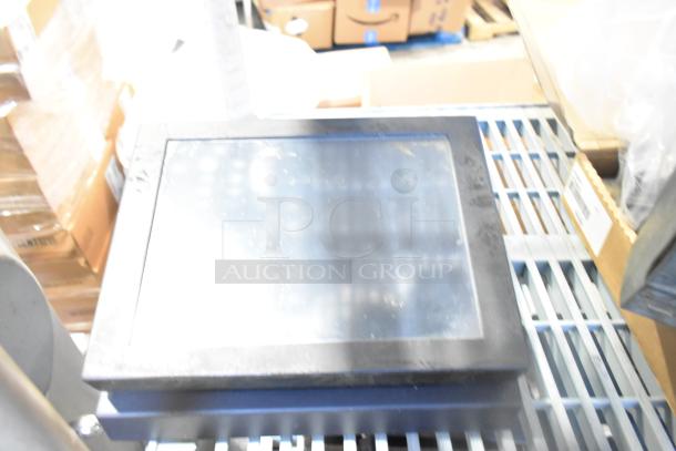 POS monitor on a metal rack, part of a lot including receipt printers and wires, slightly dusty condition.
