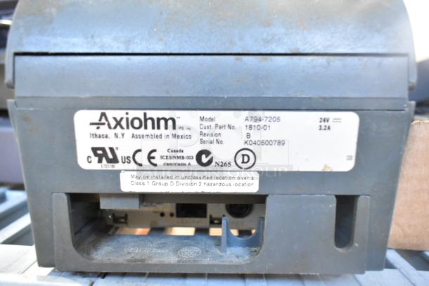 Axiom receipt printer model A794-7205, assembled in Mexico, shown with label indicating certifications and specifications.
