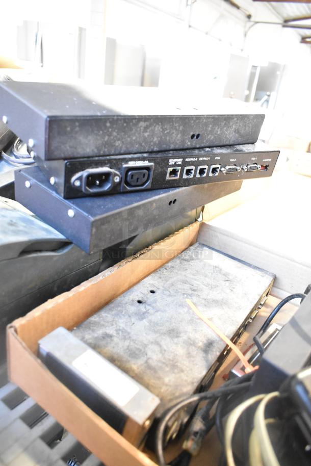 Assorted electronics including POS monitor and receipt printers. Visible Ethernet, VGA, and power ports. Condition: used.