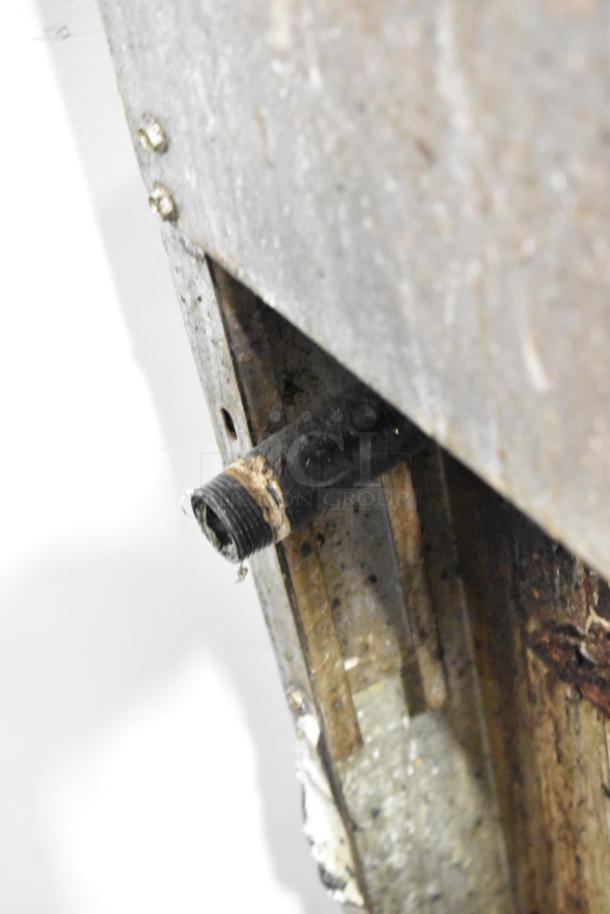 Close-up of a gas inlet or pipe, part of the American Range Commercial Gas 6 Burner Range. Slight wear visible.