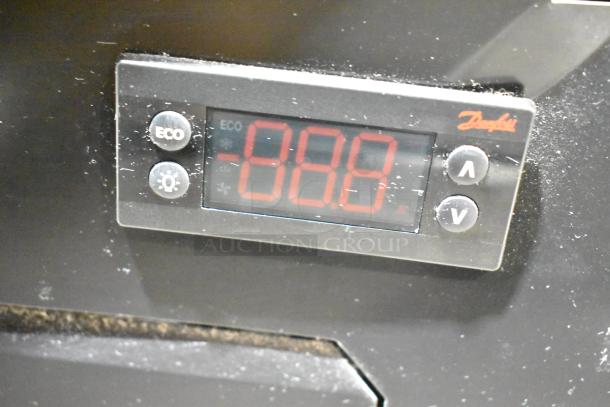 Close-up of digital display on Imbera VR08 cooler merchandiser, showing temperature controls and eco mode button.