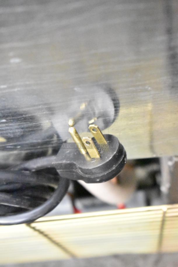 Imbera VR08 commercial cooler power plug showing three-prong design; operates at 115V, 1 Phase.