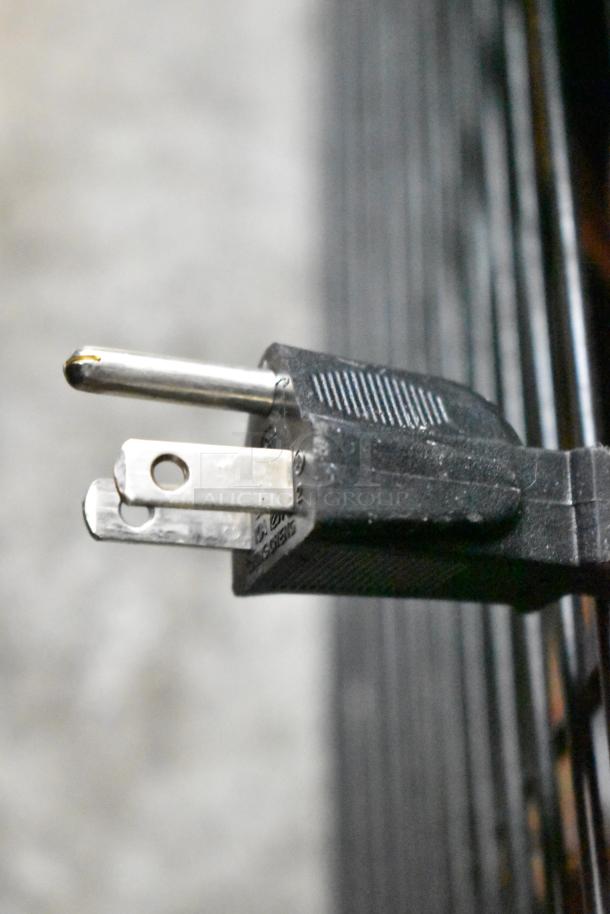 Close-up of a 115V power plug from a 2021 IDW G-12SI-N-3-3-4-B-5 single door cooler merchandiser.