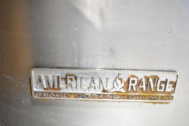 American Range logo on stainless steel surface of commercial gas-powered 6 burner range, visible wear marks.