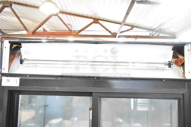 Beverage Air MT38 Commercial 2 Door Reach In Cooler Merchandiser, 115 Volts, 1 Phase. Visible wear near top area. Model MT38.