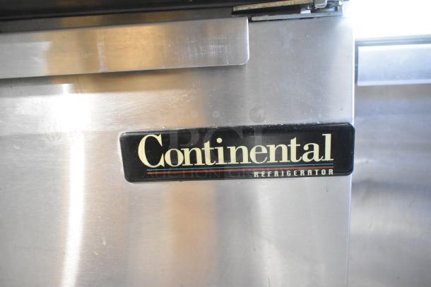 Continental DL36-15M Sandwich Prep Table label, stainless steel, commercial casters, 115V, 1 Phase, in used condition.
