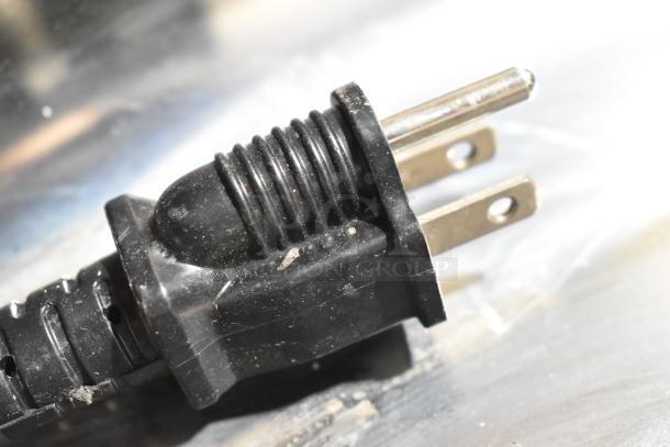 Close-up of the plug for a Rocket Cooking RC-ENFW1204CK commercial food warmer, 120 volts, 1 phase.