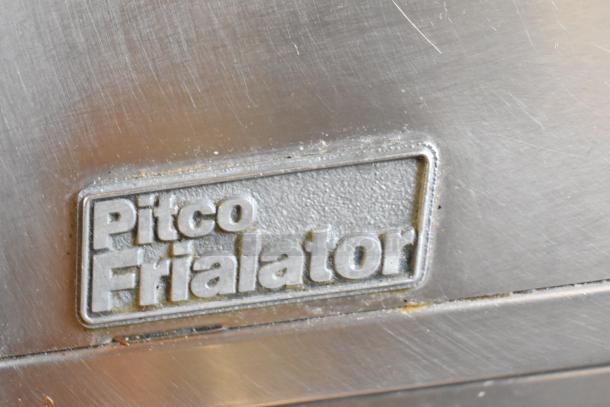 Pitco Frialator SR14-S logo on a commercial natural gas deep fat fryer, stainless steel surface visible.