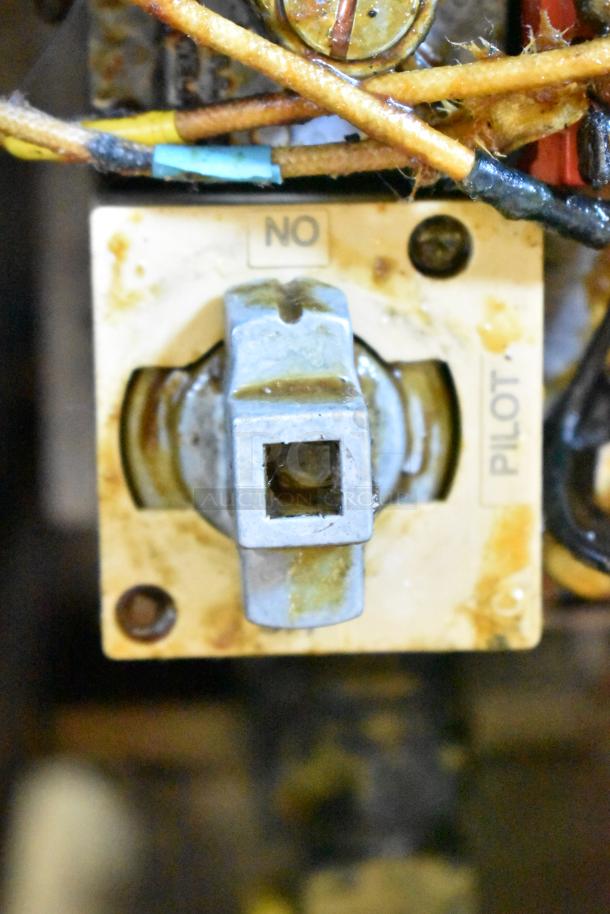 Close-up of a Pitco Frialator SR14-S fryer pilot control with visible wiring, showing signs of use.