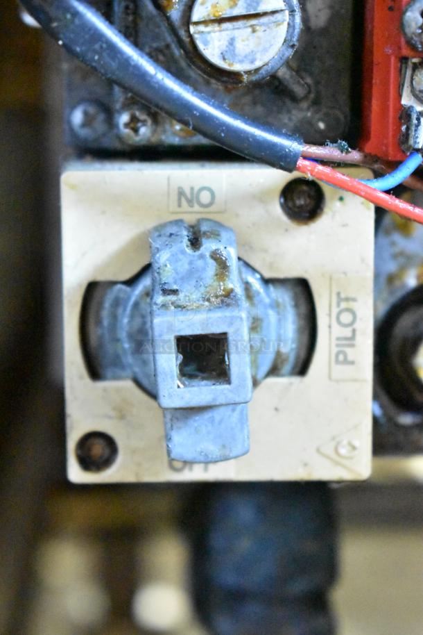 Close-up view of the control panel on the Pitco Frialator SR14-S deep fat fryer, with visible wear.