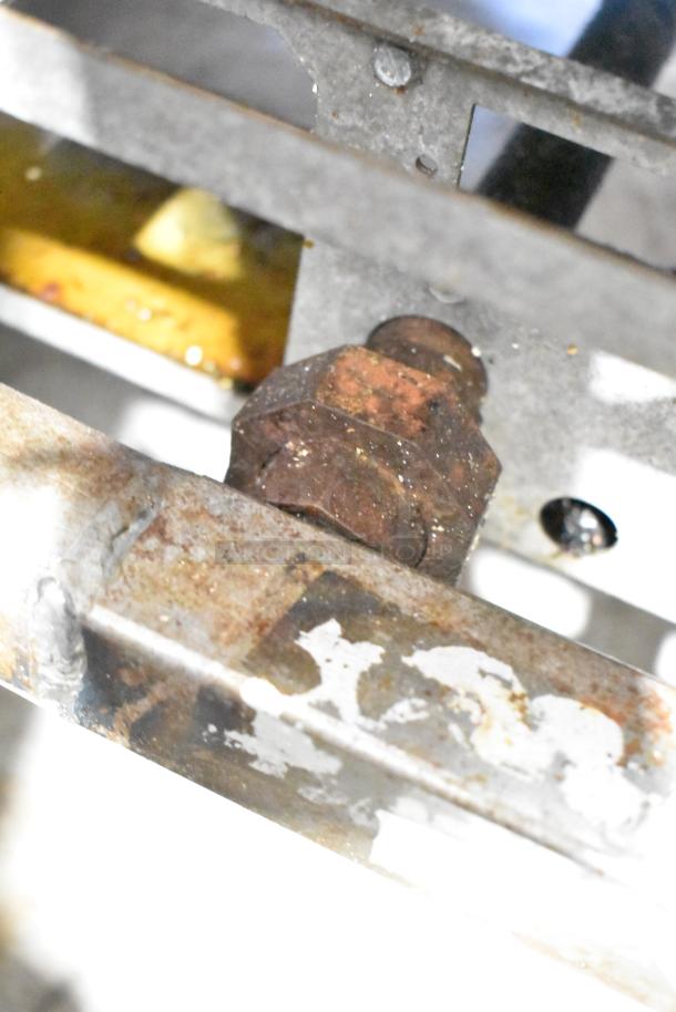 Rusty components of Pitco Frialator SR14-S fryer, showing wear. No visible labels or markings.