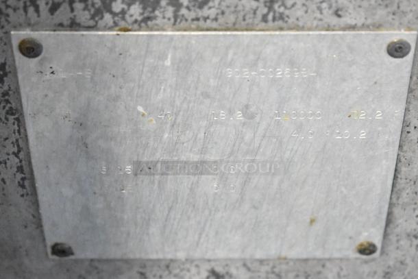 Metal tag on Pitco Frialator SR14-S fryer displaying model and specifications. Slight wear visible.