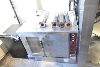 Southbend commercial gas convection oven, view-through and solid doors, thermostatic controls, metal legs, fair condition.