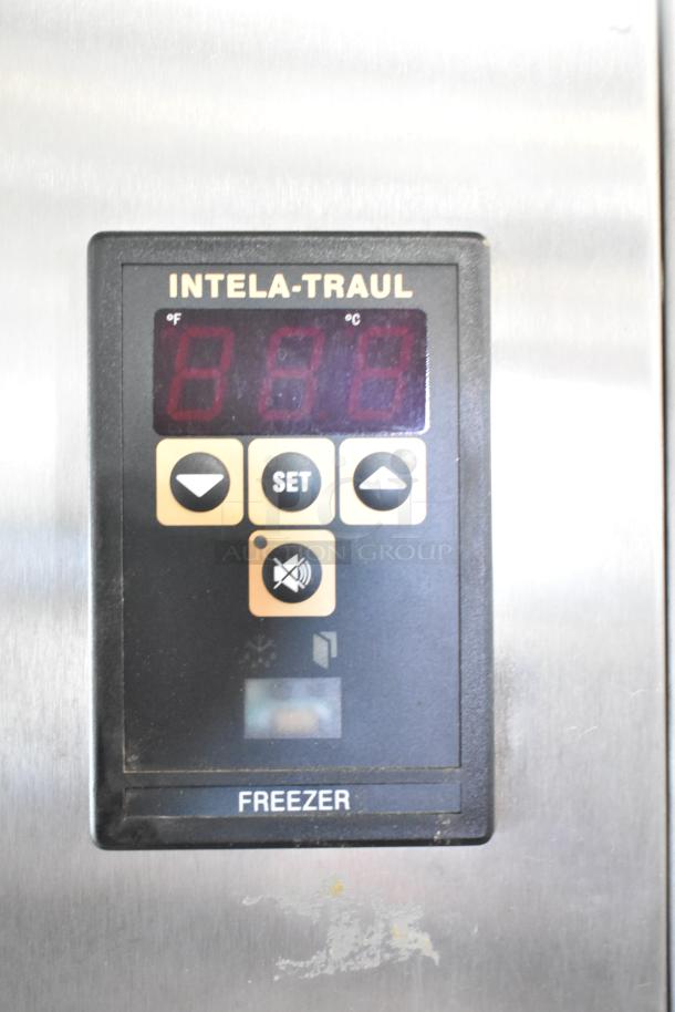 Traulsen RLT232WUT-FHS freezer control panel, showing digital display and buttons. Needs door reattachment; missing hinges.