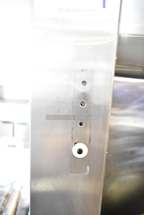 Traulsen RLT232WUT-FHS commercial freezer. Two doors, missing hinges; needs reattachment. 115 volts, 1 phase.