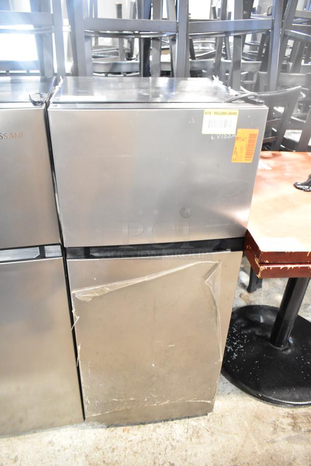 Vissani HVDR45PS cooler with freezer, stainless steel exterior, 115V, visible wear. Label on top indicates RTV status.