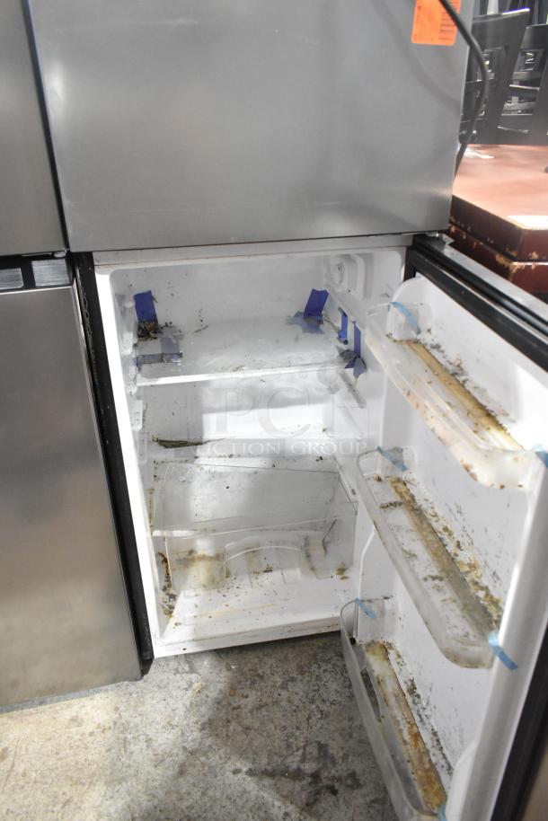 Vissani HVDR45PS Cooler with freezer, visible internal wear and dirt, 115V, 1 phase, model tag inside door.