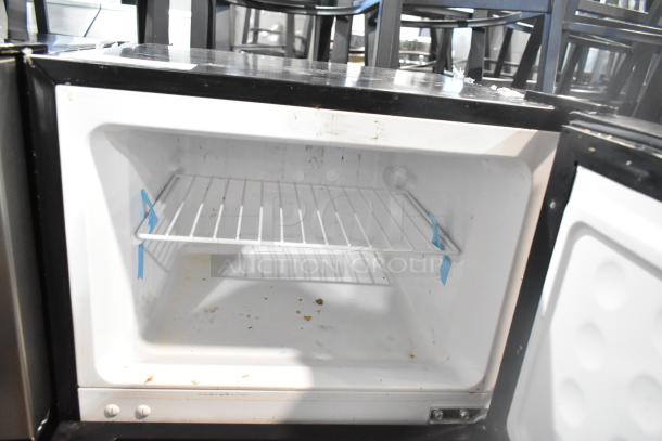 Vissani HVDR45PS cooler with freezer, 115 volts, used condition, internal wire shelf, some surface wear visible.