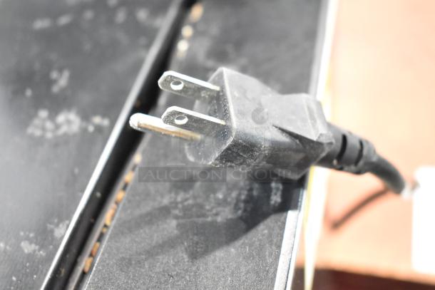 Vissani HVDR45PS cooler plug, 115 volts, 1 phase. Black cord, visible dust, indicating prior use.