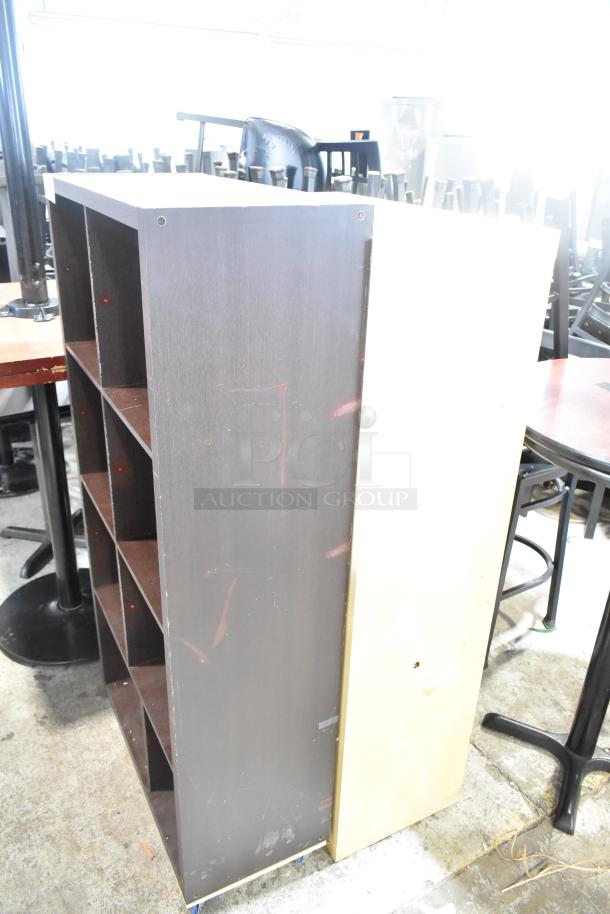 Two wooden bookshelves, one dark brown and one light, each with multiple shelves. Visible scratches indicate used condition.