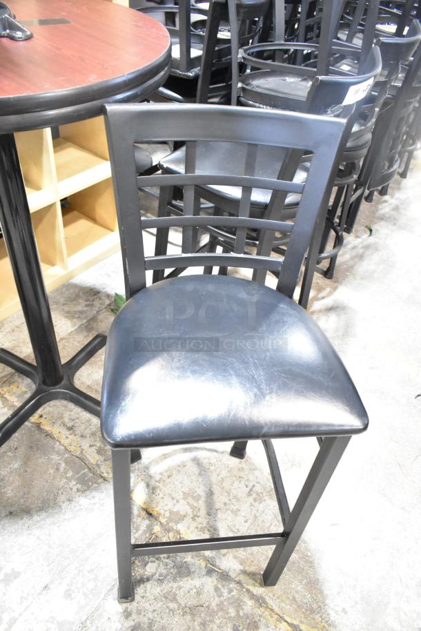 37 black bar height chairs feature window back design, black seat cushions; durable, ideal for commercial use.