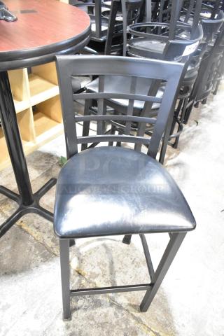 37 black bar height chairs feature window back design, black seat cushions; durable, ideal for commercial use.
