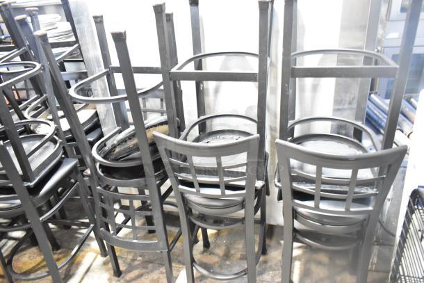 37 black bar height chairs, window back design, black seat cushion, stacked, good condition, auction lot.