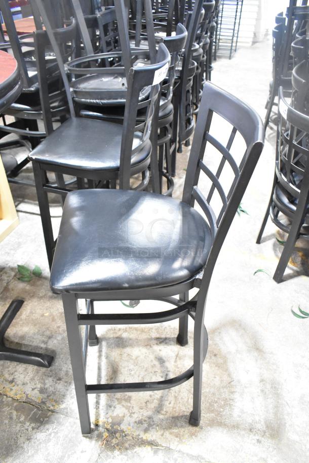 37 black window back bar height chairs with black seat cushions, sturdy metal frame, light wear, sold 37 times your bid.