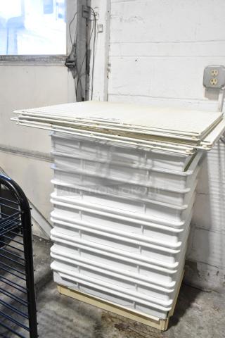 10 white ply dough bins stacked with 3 white finish racks on top. Clean condition, ideal for industrial baking use.