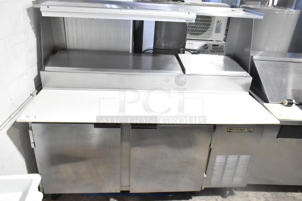 Beverage Air DP67 Commercial Pizza Prep Table with over shelf and casters. Stainless steel, 115V, 1 phase, label visible.