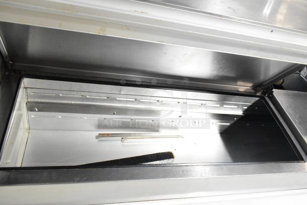 Beverage Air DP67 commercial pizza prep table with over shelf, stainless steel interior, on casters, 115V, 1 phase.