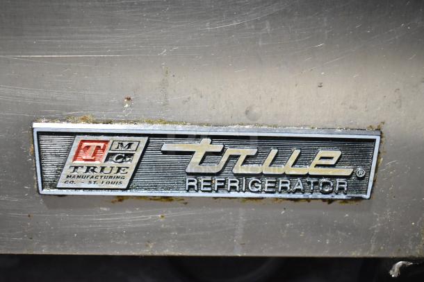 True TSSU-72-30M-B-ST prep table, stainless steel with logo plate. Model features mega top, Bain Marie style, on casters.