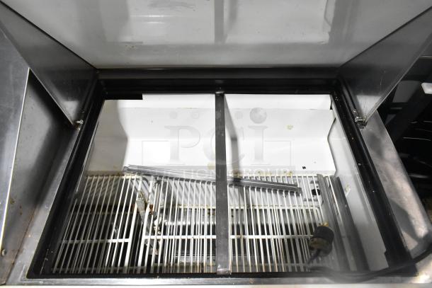 True TSSU-72-30M-B-ST prep table interior with wire racks, showing spacious compartment, suitable for commercial use.