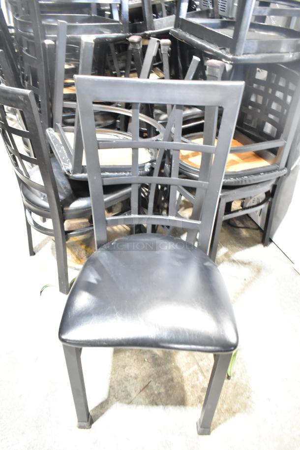Set of 36 black dining height chairs, featuring window back design and black seat cushions. Condition appears used.