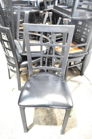 Set of 36 black dining height chairs, featuring window back design and black seat cushions. Condition appears used.
