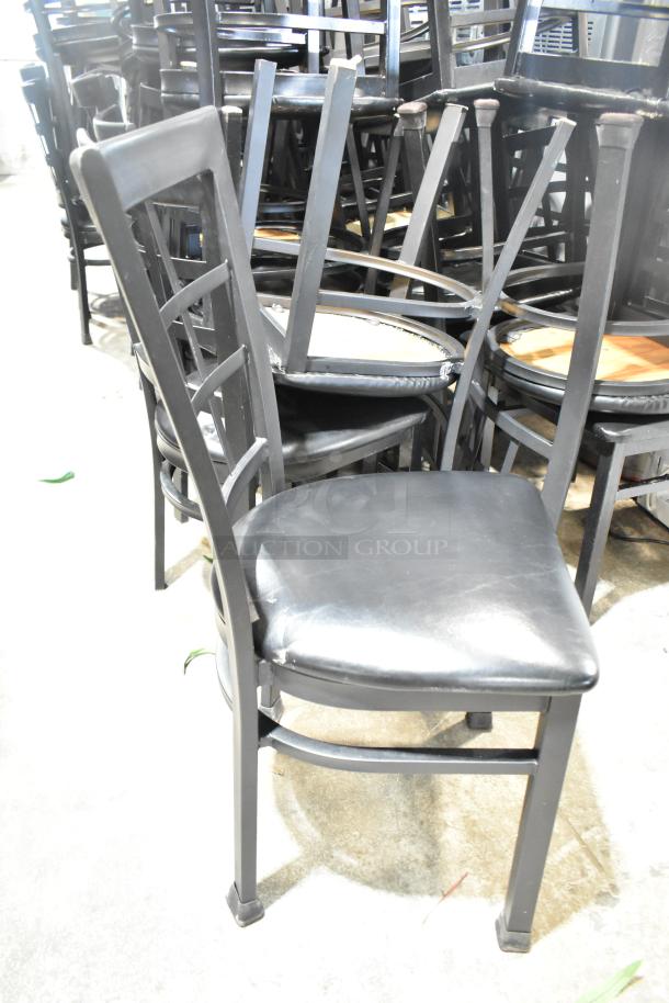 Black window back dining chair with black seat cushion, sturdy design, in good condition. Set of 36 available.
