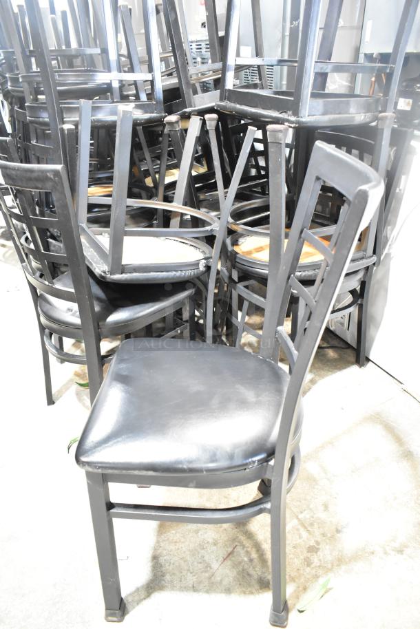 36 black window back dining chairs with black seat cushions, stackable design, in used condition.