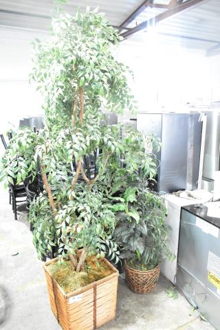 Two large fake plants in woven baskets, vibrant green foliage, excellent condition, ideal for home or office decor.