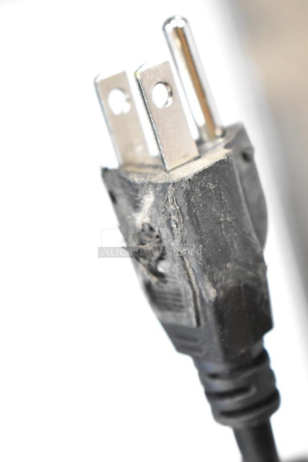 Close-up of worn plug for Vissani HVBC58ST Mini Cooler Merchandiser. Damage visible on the casing; requires repair.